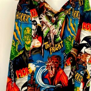 Black dress with monsters on top.  Great dress!  Size Small